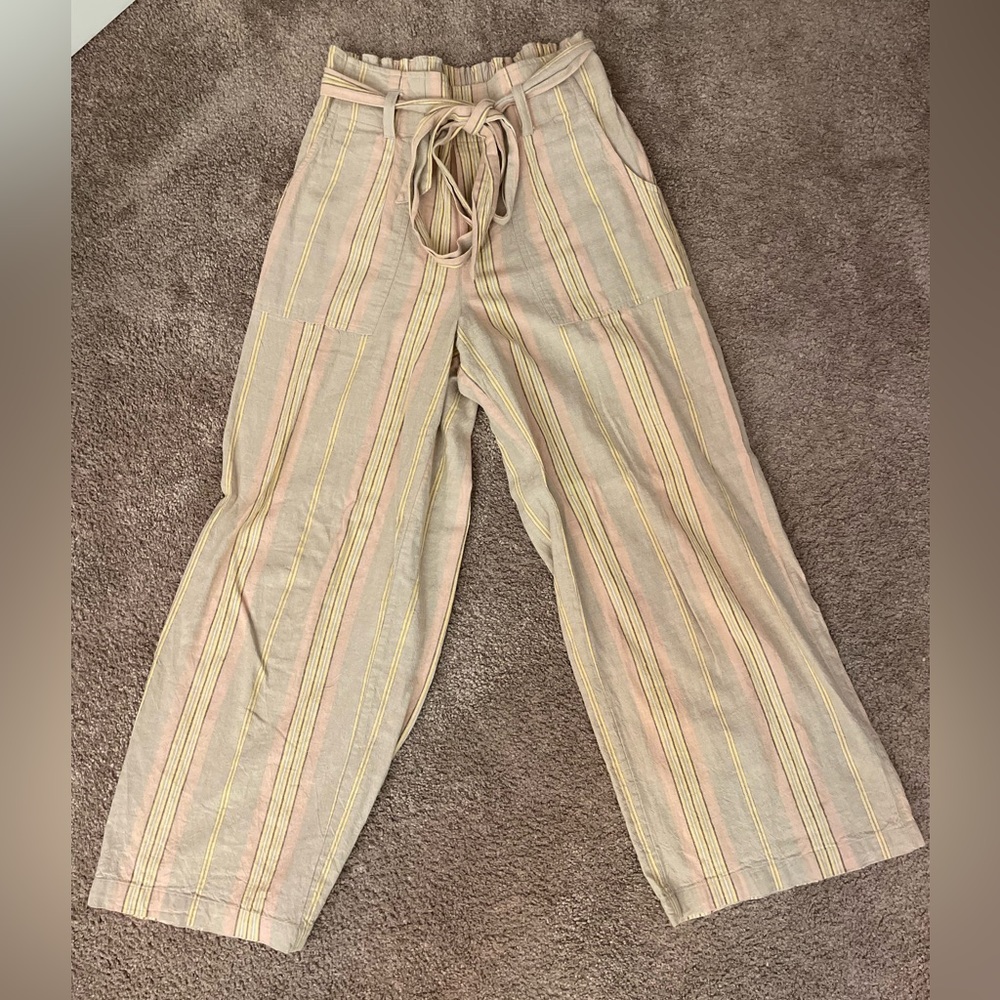 Tan wide leg pants with yellow and pink stripes